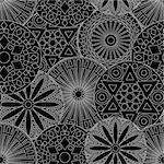 Black and white seamless floral pattern with various stylized geometric flowers, vector illustration