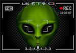 Camera viewfinder rec green alien face with black eyes on transparent dark background. Record video with stranger. Invader head. UFO theme
