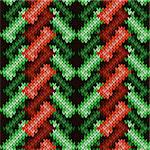 Ornate knitting seamless vector pattern as a fabric texture in various green, orange and brown hues