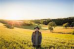 Portrait of mid adult man, standing in field, Neulingen, Baden-Württemberg, Germany