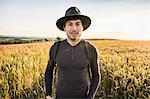 Portrait of mid adult man, standing in field, Neulingen, Baden-Württemberg, Germany