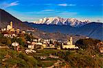 Town with vineyards and mountain range beyond