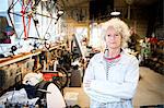Portrait of woman in bicycle repair shop