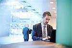 Businessman typing on laptop in office