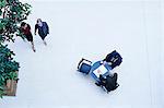 Overhead view of businessmen meeting in office atrium