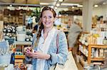 Portrait confident woman shopping in shop