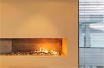 Modern rock gas fireplace in home showcase interior
