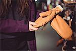 Close-up of woman selecting gloves in a shop