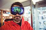 Close-up of handsome man in ski goggles