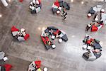 Students groups sitting in a modern university atrium