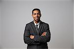 Studio Portrait Of Businessman Wearing Suit