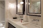 A luxurious bathroom in a central London apartment in Knightsbridge. Mirrors.