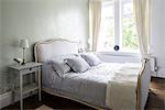 Interior view of a residential building decorated in Edwardian Style, in Newcastle-upon-Tyne, UK. The bedroom.