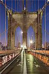 Dusk on the Brooklyn Bridge in New York, New York State, USA.