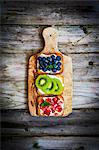 Healthy fruit open sandwiches on a wooden board