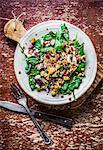 Spinach salad with quinoa, butternut squash, pepper and tomatoes