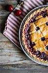 Homemade cherry pie on a rustic surface