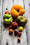 Colourful heirloom tomatoes on rustic wooden surface