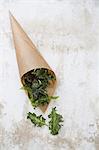 Kale crisps in a brown paper bag