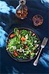 Rocket and spinach salad with tomatoes and flaked almonds