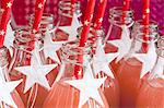 Fruit juice in glass bottles decorated with white stars