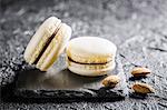 Almond macaroons on a black stone