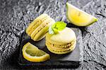 Lemon macaroons on a black stone