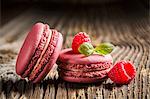 Raspberry macaroons on a wooden table
