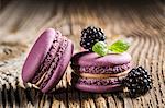 Blackberry macaroons on a wooden table