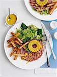 Gammon steak with pineapple, chips and salad