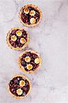 Mini shortcrust pies with cherries (seen from above)