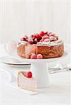 Raspberry cheesecake on a cake stand