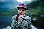 Hiker brushing teeth