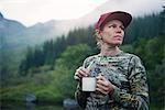 Woman in mountains looking away