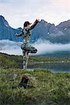 Woman in mountains doing yoga