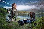 Woman in mountains doing yoga