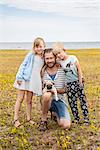 Portrait of father with two children