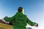 Boy flying kite