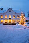 Illuminated house in winter