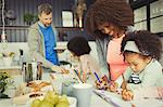 Mother and daughter coloring in kitchen