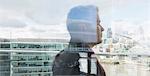 Pensive businessman looking at urban city view from balcony, London, UK