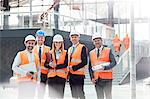 Portrait confident engineers and architects at construction site