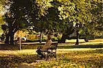 Woman sitting on a bench in the park