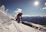Skier skiing in snowy alps during winter