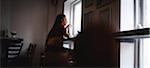 Thoughtful woman having coffee in café