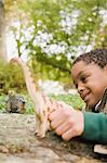 Boy playing with toy dinosaurs