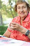Senior adult woman drinking tea