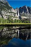 Yosemite Falls reflected in Merced River in Yosemite National Park in California, USA