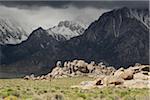 Alabama Hills and storm clouds over the mountains of the Sierra Nevadas in Eastern California, USA