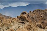 Rock formations of the Alabama Hills with the Sierra Nevada Mountains in the background in Eastern California, USA